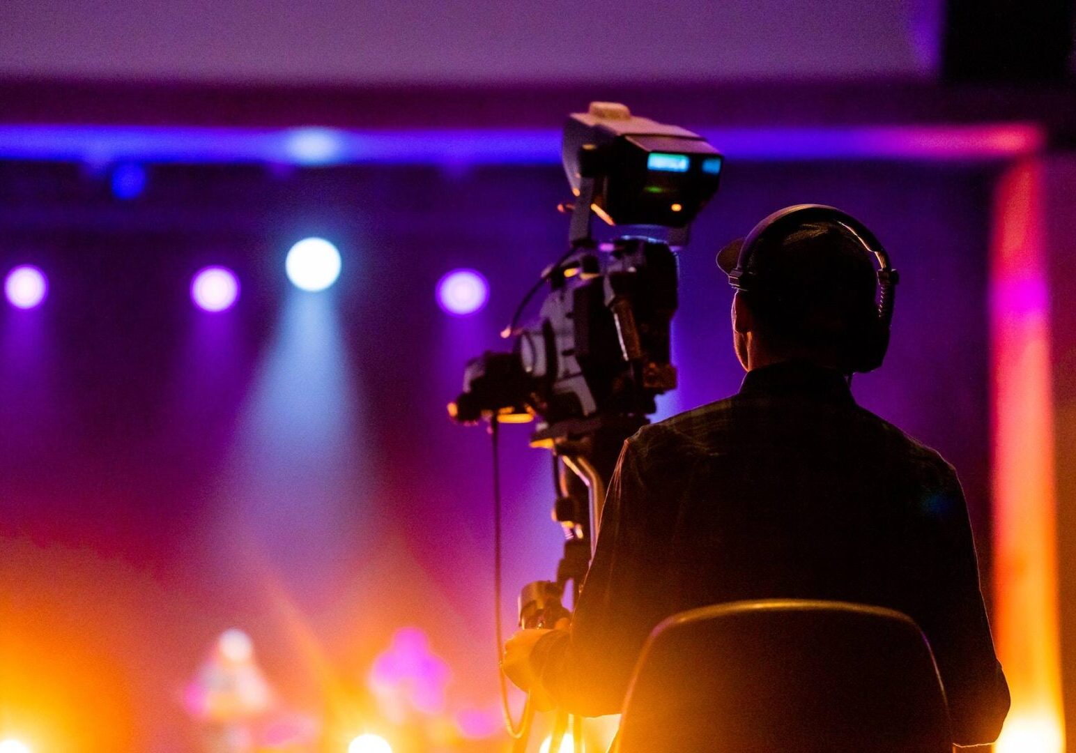 Person Sitting on a Chair in Front of a Video Camera